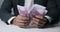 closeup of businessman hands counting 500 euro money banknotes