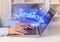 Closeup of businessman hands working on laptop