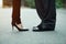 Closeup of businessman`s and businesswoman`s legs outside