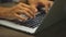 Closeup of businessman typing on laptop computer