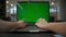 Closeup businesswoman arms texting green screen laptop office. Director working