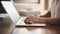 Closeup of businesswoman hands typing on laptop keyboard in office. Generative AI