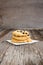 Closeup Butter cookies with chocolate chip topping on wooden ba