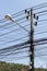 Closeup of a cable chaos at a power pole