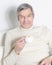 Closeup. calm elderly man with a Cup of coffee