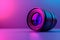 Closeup of a camera lens on a purple and electric blue background