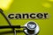 Closeup cancer with stethoscope concept inspiration on yellow background