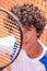 Closeup capturing video of a charismatic young tennis player he sitting down on the clay court beside the tennis net and