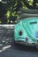 Closeup of car. Retro car green color. Rear view of the car. Car for surfers and hippies