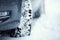 Closeup of car tires on a snowy road.Blizzard on the road