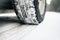 Closeup of car tires on a winter road covered with snow. Safe braking distance