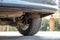 Closeup of a car wheel parked near curb on the side of the street on a parking lot