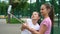 Closeup of carefree young girls making funny faces and smiling for selfies