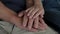 Closeup Caring Woman Holds Strokes Hands Of An Old Man Supporting And Calming