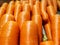 Closeup carrot laying lined up on the vegetables`s shelf in the market