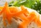 Closeup of carrot shavings on Gefilte Fish