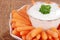Closeup carrots with salad dip focus on parsely