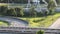 Closeup of cars driving on highway in Schiedam, The Netherlands during daytime with low traffic and sunshine.