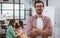 Closeup on caucasian beard handsome creative and business man wearing casual shirt and eyeglasses, crossing arms and smiling with