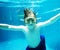 Closeup of caucasian boy underwater in the pool