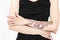 Closeup of Caucasian Female Hands With Artistic Snake Tattoo Posing Against White
