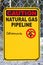 Closeup of a Caution Natural Gas Pipeline sign