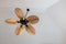 Closeup ceiling fan on white cement house ceiling background
