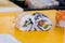 Closeup of chef hands preparing japanese food. making sushi at restaurant.