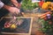 Closeup of Chef hands serving beef steak