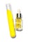 Closeup chemical ingredient on white laboratory table. Yellow cosmetic liquid oil in dropper bottle place next to Potassium