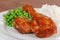 Closeup chicken leg with barbecue sauce and peas