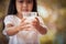 Closeup child hand holding a glass of milk