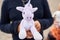 Closeup of a child holding a unicorn teddy bear