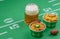 Closeup of chili and mug of beer and football decorations on tab