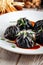 Closeup on chinese black dumplings with soy sauce