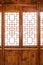 Closeup Chinese old wooden frame door with decorative pattern under the sunshine
