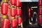 Closeup of Chinese red festive lanterns on walls of a narrow street