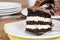 Closeup chocolate cream cake on plate