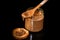 closeup chocolate peanut butter in glass jar and small cracker