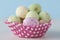 Closeup of chocolate speckled Easter eggs in cupcake liner.