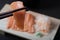 Closeup chopsticks raw salmon sashimi