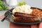 Closeup of chorizo sausages with mashed potato and baked beans
