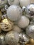 Closeup Christmas ornaments gold silver and white