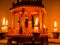 Closeup of Christmas pyramid with lit candles - Figures in the center are captured in motion