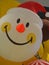 Closeup Christmas Santa Claus Smiley face yellow ball balloon