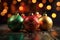 Closeup of Christmas tree baubles on blurred golden sparkling fairy background