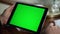 Closeup chroma key tablet in businessman hands. Manager hold mockup device