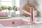 closeup of a chrome pink kitchen faucet in a modern kitchen