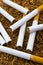 Closeup of cigarettes detail on tobacco background