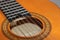 Closeup of classic acoustic guitar strings and fret board